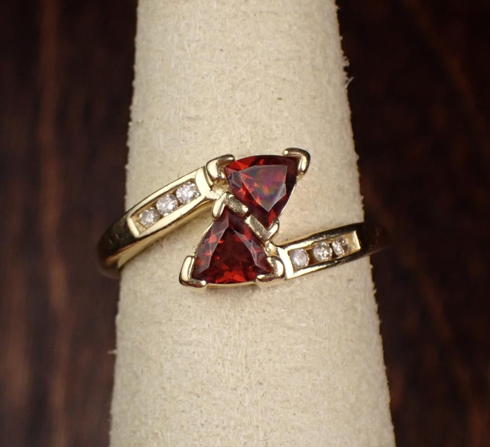 Appraisal: GARNET DIAMOND AND YELLOW GOLD RING The k gold ring