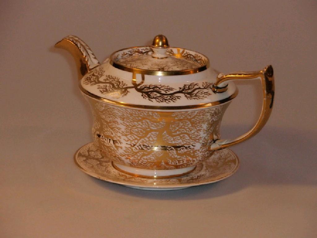 Appraisal: A thC English porcelain tea pot and stand with acanthus