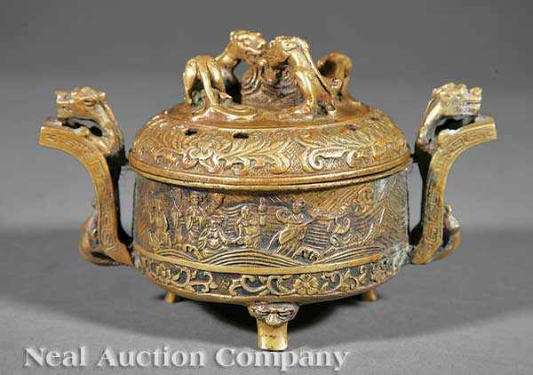 Appraisal: A Chinese Bronze Tripod Censer the cylindrical body raised on