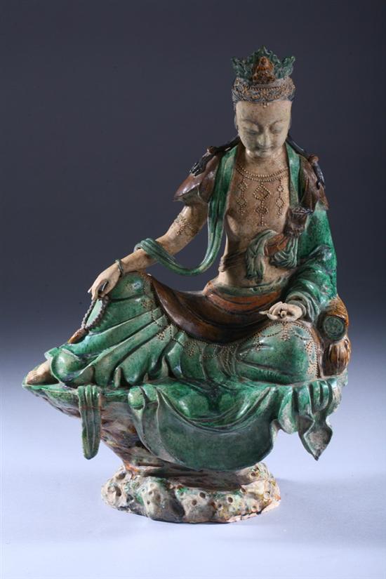 Appraisal: CHINESE SANCAI POTTERY FIGURE OF GUANYIN Ming Dynasty style Seated