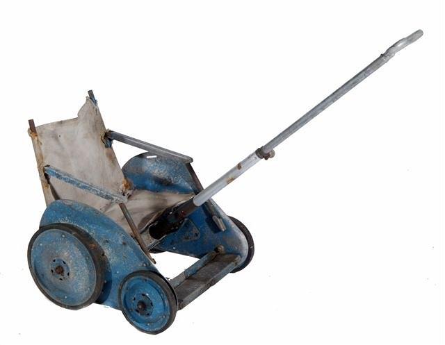 Appraisal: A POST WAR ALUMINIUM COLLAPSIBLE CHILD'S PUSH CHAIR with traces