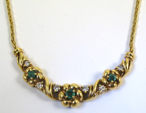 Appraisal: EMERALD AND DIAMOND PENDANT NECKLACE k yellow gold The pendant