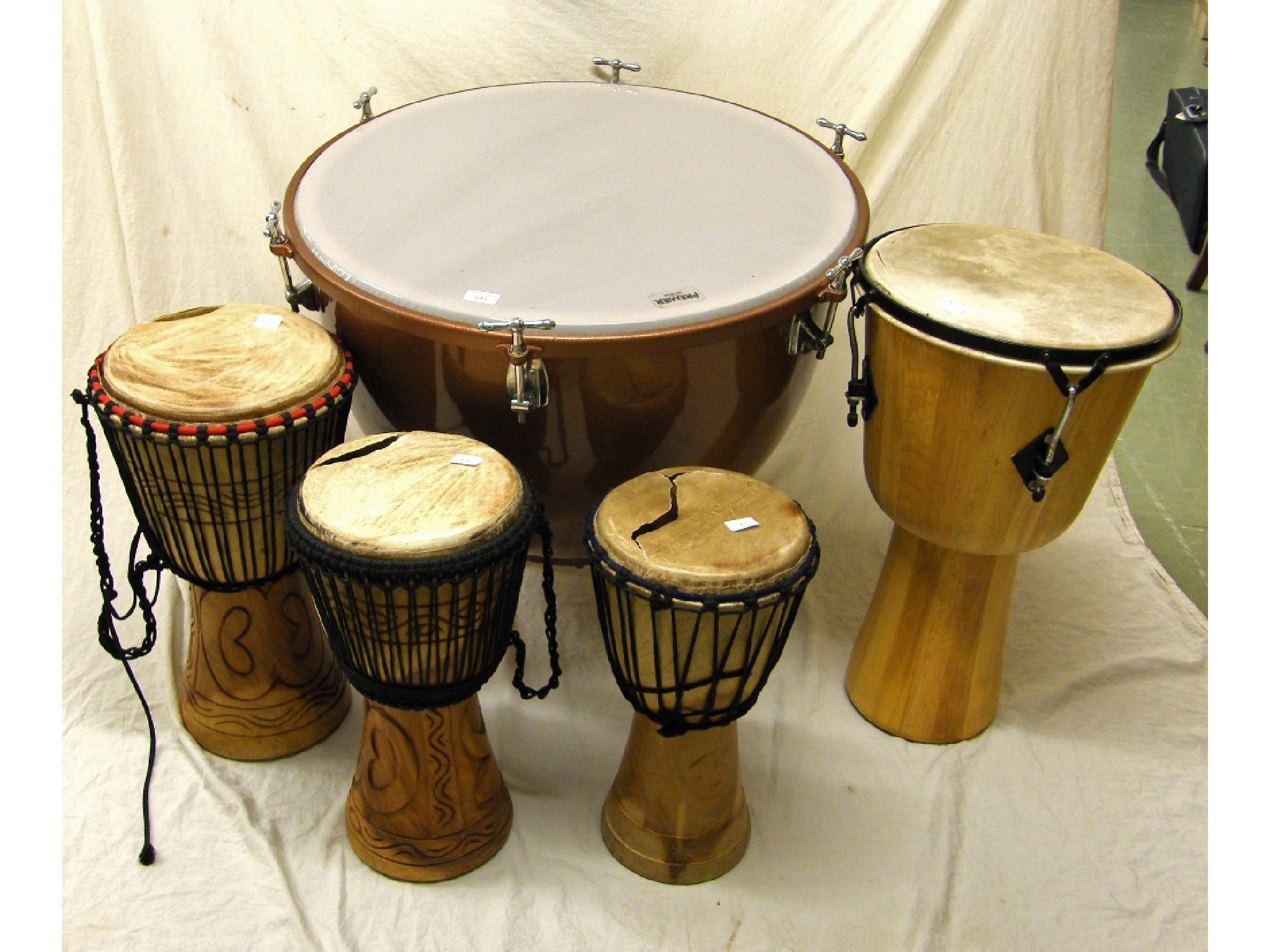 Appraisal: Premier timpani with cover together with four Djembe drums all