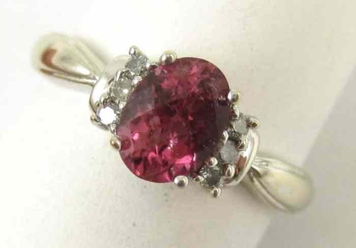 Appraisal: PINK TOURMALINE AND DIAMOND RING k white gold with three