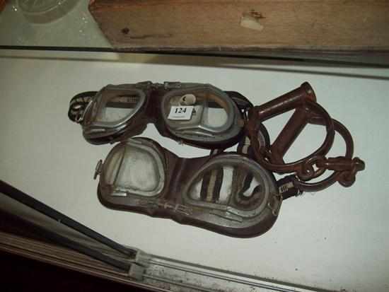 Appraisal: A PAIR OF ANTIQUE MOTORBIKE GOGGLES AND HANDCUFFS