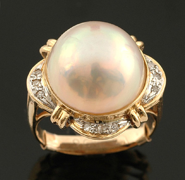 Appraisal: A mabe pearl and diamond ring The bezel set pearl