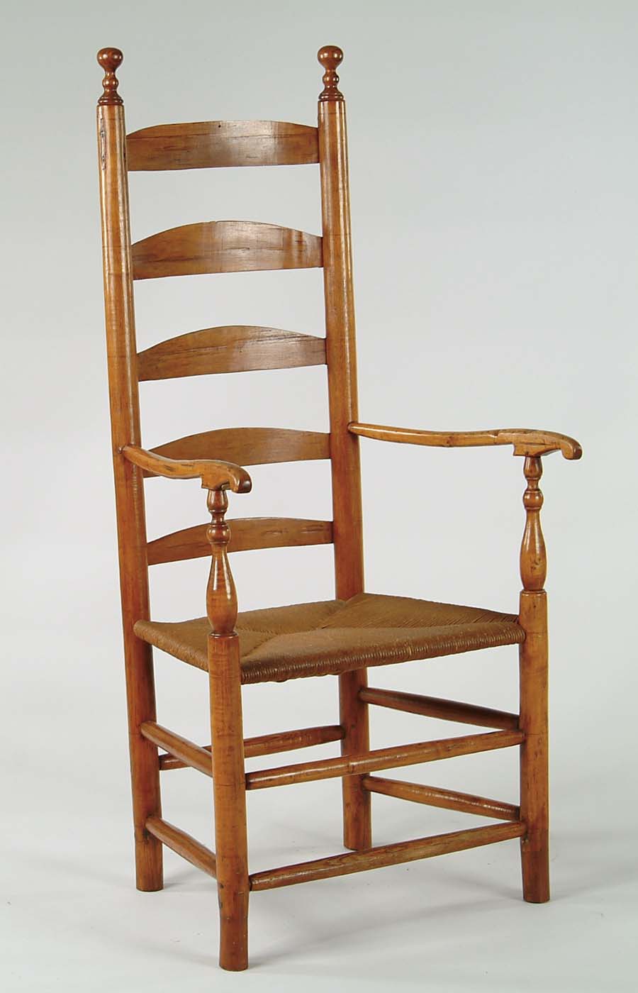 Appraisal: EARLY LADDERBACK ARMCHAIR Five horizontal slats ball turned finials carved