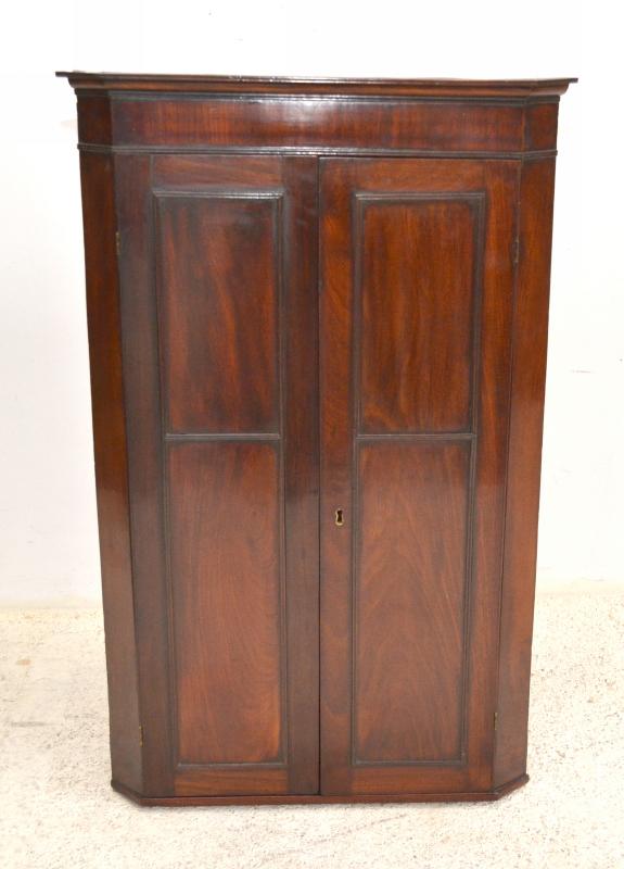 Appraisal: A VICTORIAN MAHOGANY TWO DOOR CORNER CABINET A VICTORIAN MAHOGANY