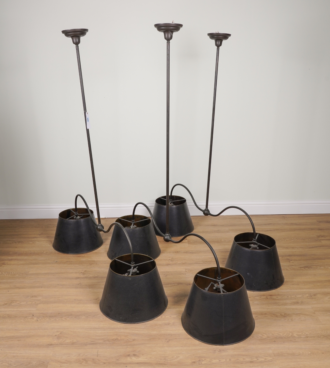 Appraisal: A SET OF THREE PATINATED METAL TWIN LIGHT HANGING LIGHTS