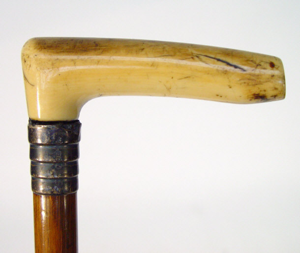 Appraisal: Simulated bamboo walking cane with ivory handle and a similar