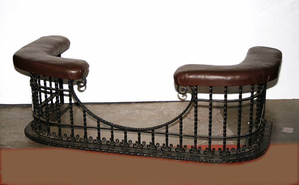 Appraisal: A Spanish Baroque style wrought iron and upholstered fire fender