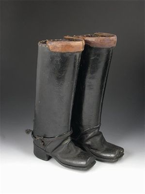 Appraisal: A pair of th century leather postillion boots with stitched