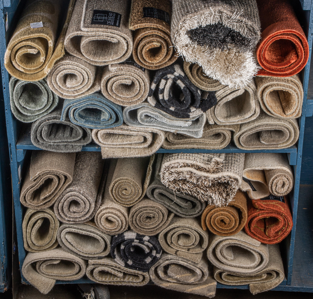 Appraisal: TWO SHELVES OF SMALL HAND KNOTTED RUGS SOME BY CHRIS