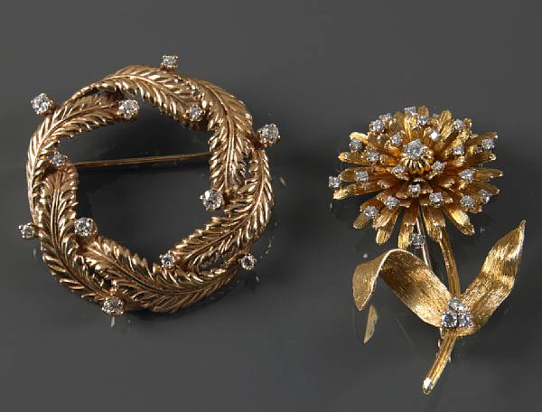 Appraisal: A collection of two diamond and gold brooches comprising of