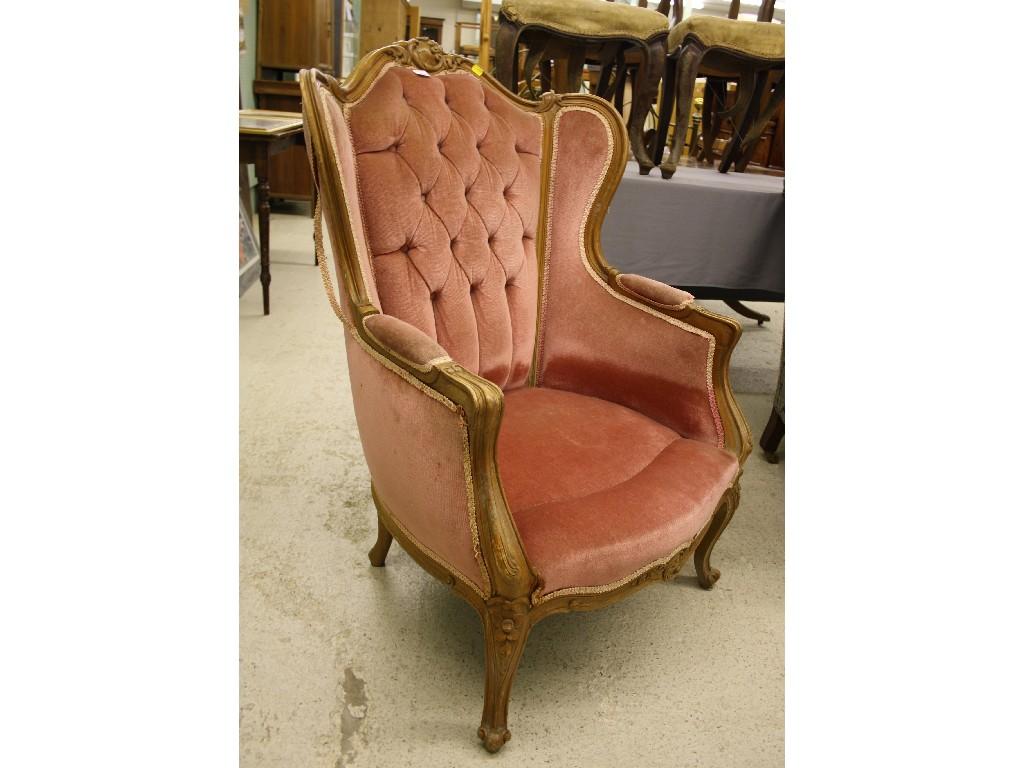 Appraisal: French walnut Louis XV style fauteuil with button back and