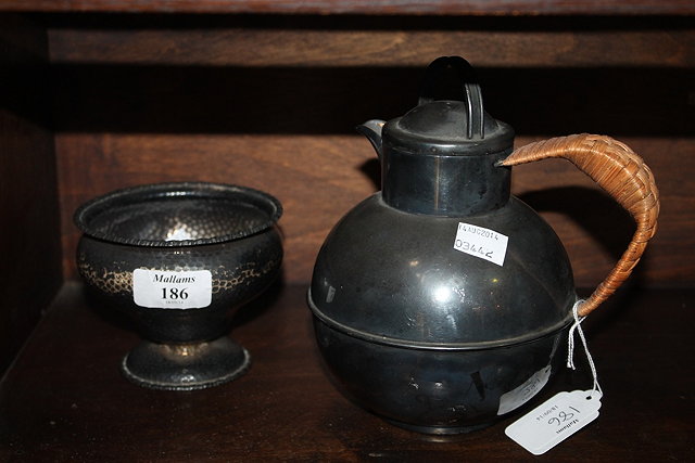 Appraisal: A HAMMERED SILVER BOWL of baluster form on pedestal foot