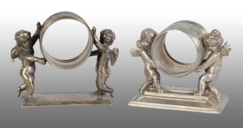 Appraisal: Lot of Figural Napkin Rings Description Includes two winged cherubs