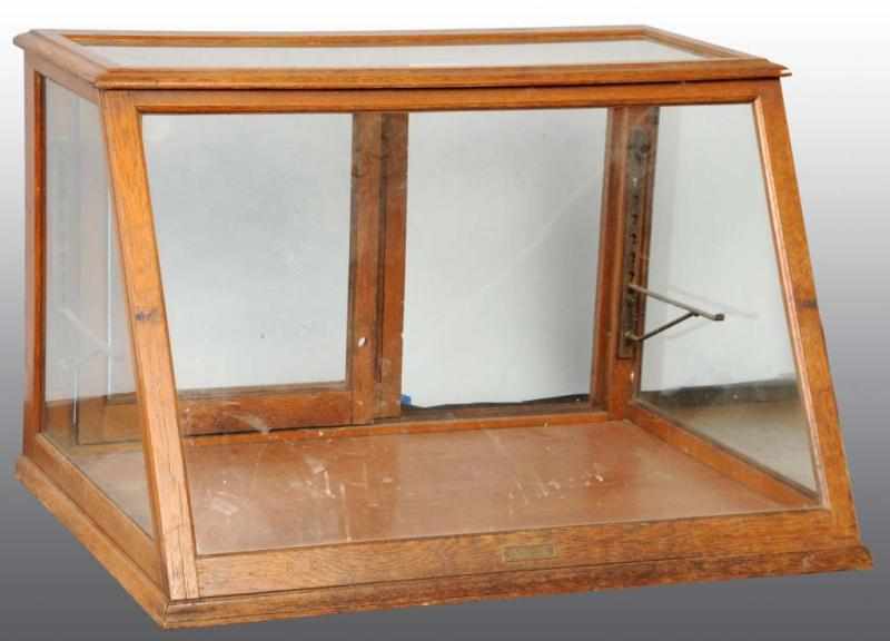 Appraisal: Country Store Slant Front Glass Display Case Description By Columbia