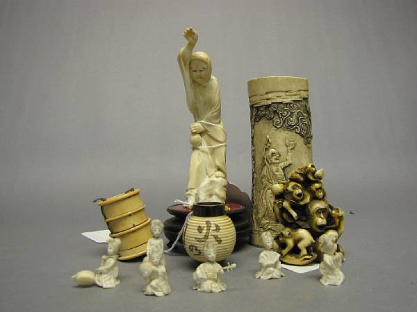 Appraisal: A group of ivory composition and bone decorations Meiji Period