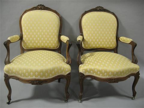 Appraisal: PAIR OF LOUIS XV STYLE ROSEWOOD FAUTEUILS Arched crest with