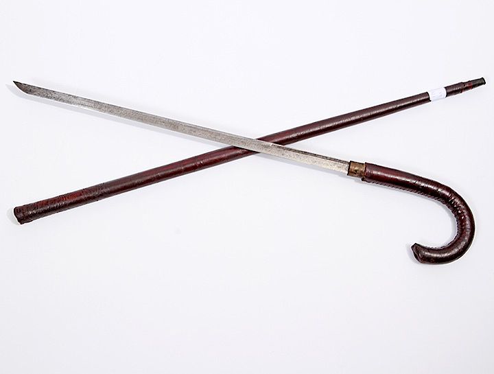 Appraisal: Leather Sword Cane Ca - A leather covered crutch handle