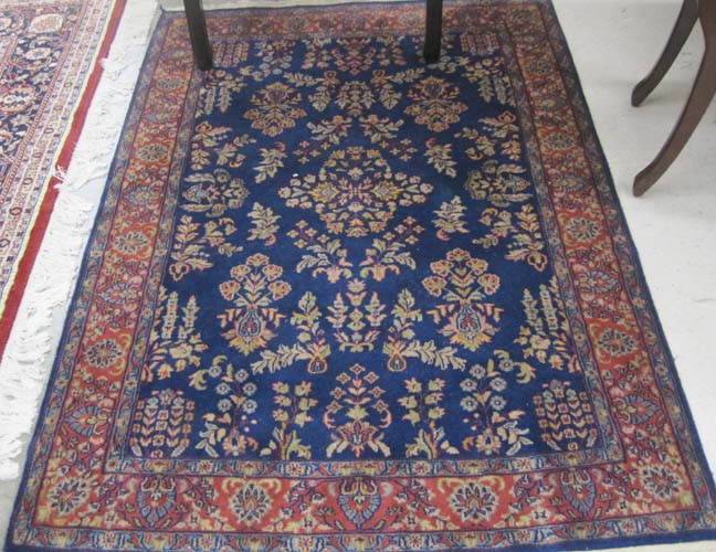 Appraisal: HAND KNOTTED ORIENTAL AREA RUG Indo-Persian blue field Sarouk design