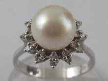 Appraisal: A white metal tests carat gold cultured pearl and diamond