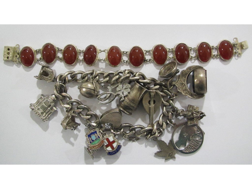 Appraisal: Lot comprising a silver charm bracelet with various charms and