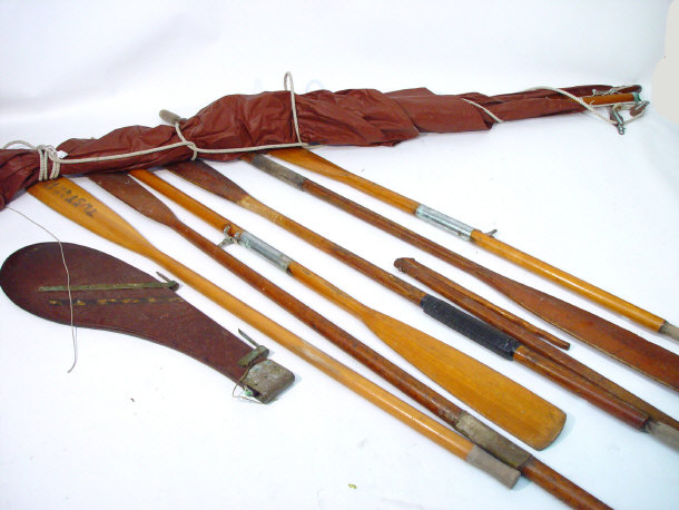 Appraisal: Collection of wooden boat oars a mast and a rudder