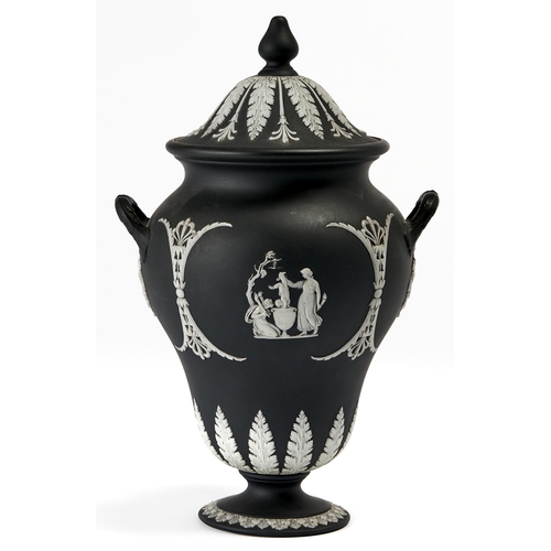 Appraisal: A Wedgwood black jasper dip vase and cover c sprigged