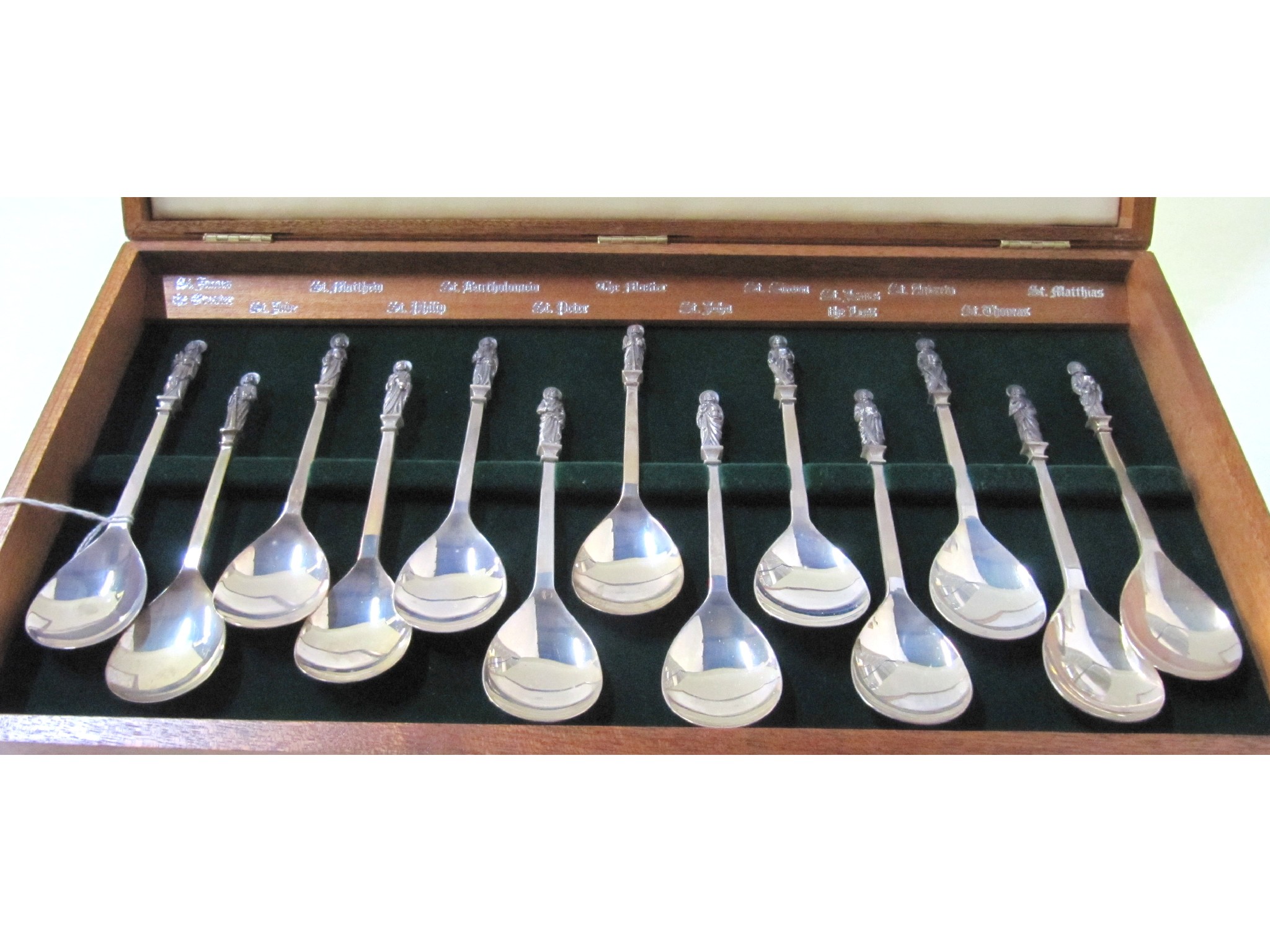 Appraisal: A cased set of thirteen silver dessert spoons with finials