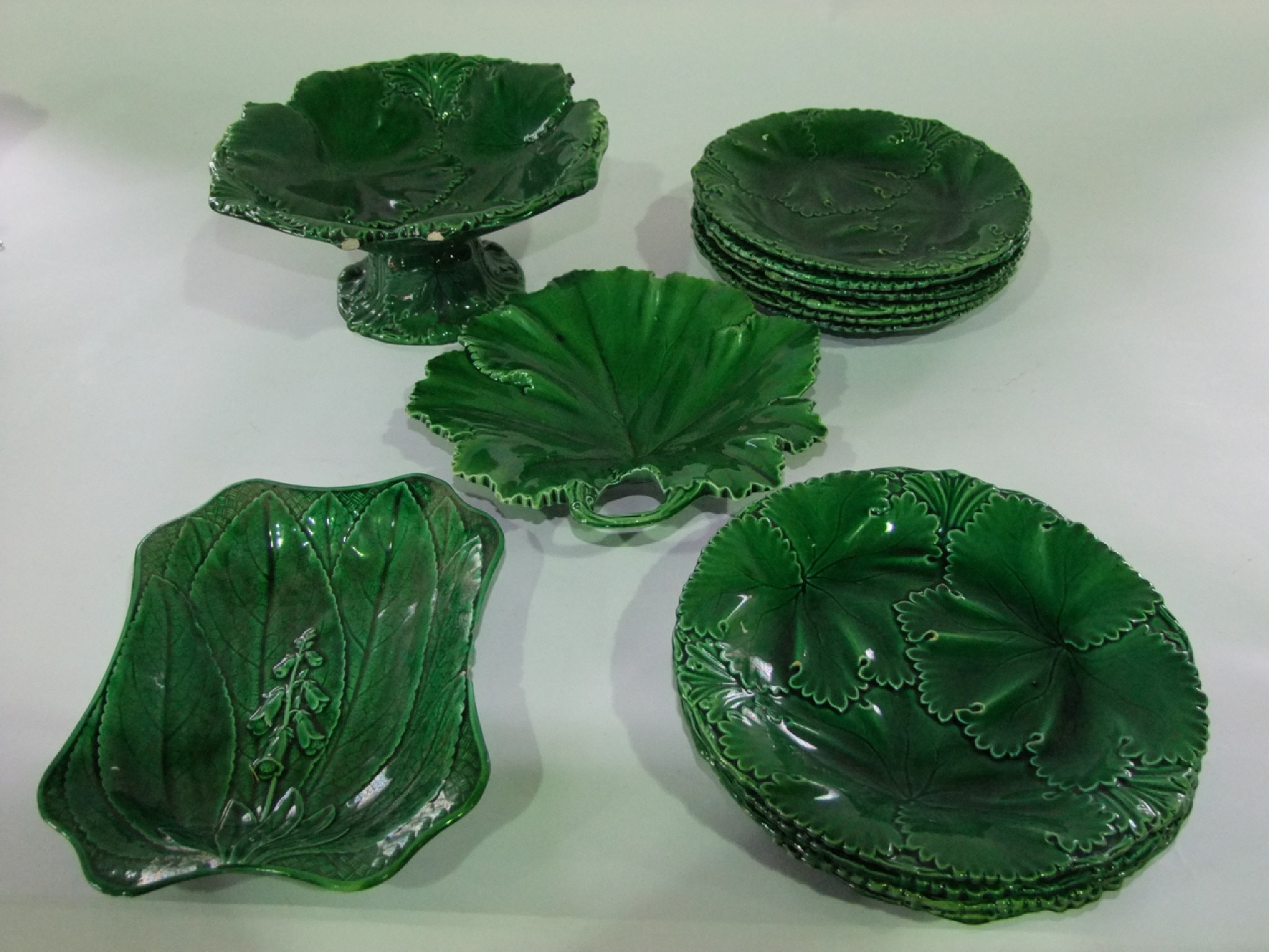 Appraisal: A collection of th century green glazed majolica dessert wares