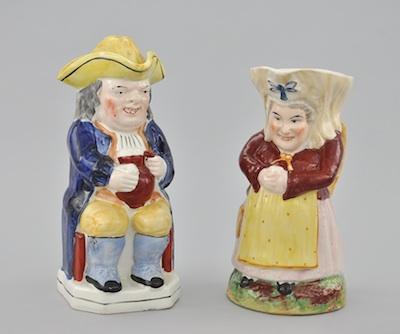 Appraisal: A Pair of Staffordshire Toby Jugs The first an Ordinary