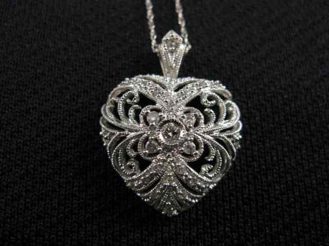 Appraisal: Diamond Pendant Chain heart shape pendant with diamonds throughout fancy