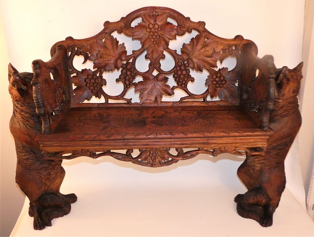 Appraisal: BLACK FOREST ANTIQUE FOX BENCH th century carved walnut Black