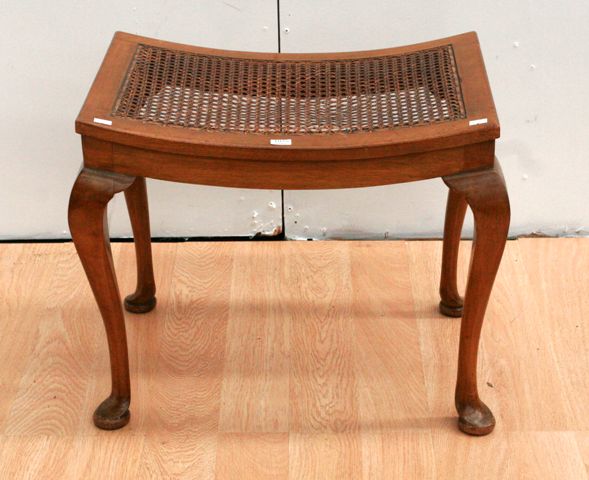 Appraisal: A stained beech and caned dressing stool