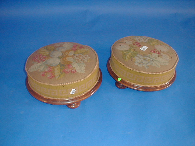 Appraisal: A pair of Victorian circular footstools with mahogany frames and