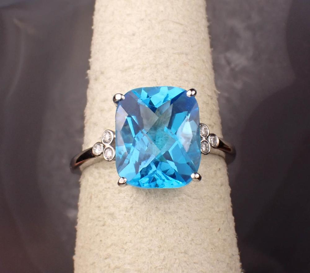 Appraisal: BLUE TOPAZ DIAMOND AND FOURTEEN KARAT GOLD RING The white