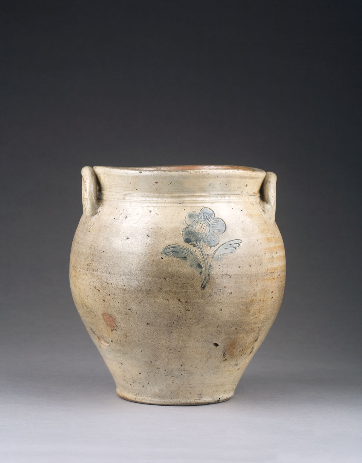 Appraisal: AMERICAN STONEWARE JAR OF BULBOUS FORM WITH INCISED FLORAL DECORATION