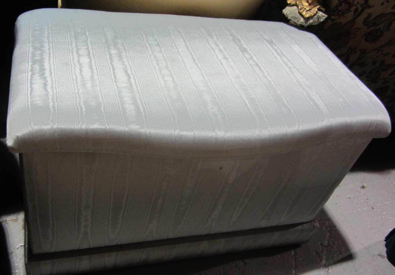 Appraisal: A th century blue silk upholstered ottoman