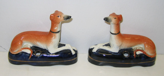 Appraisal: PAIR OF STAFFORDSHIRE WHIPPET INKWELLS Each orange painted dog reclining