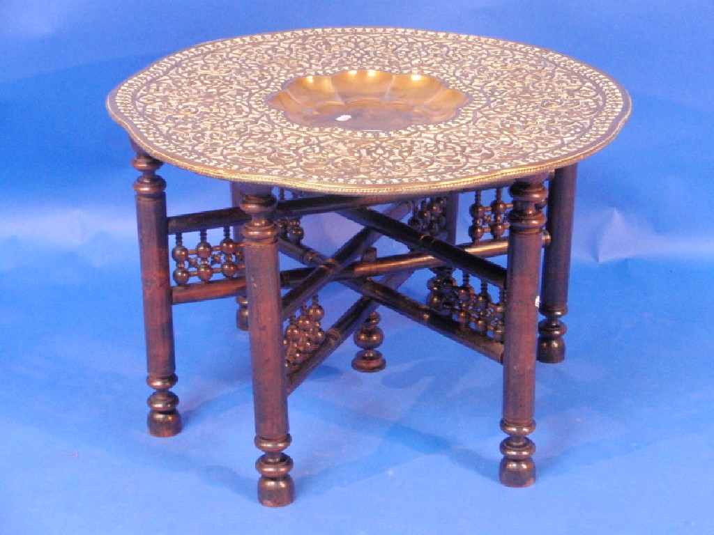 Appraisal: A large Indian brass tray top table with recess centre