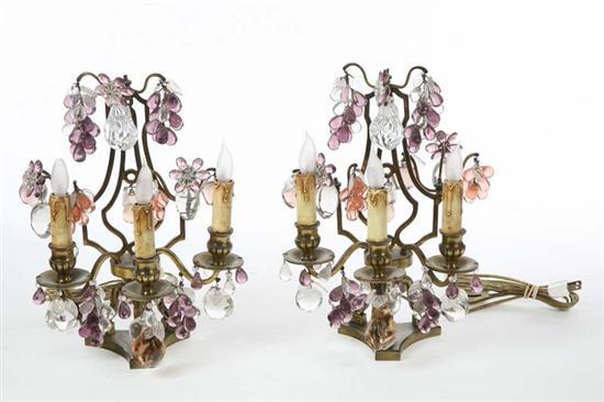 Appraisal: TWO ELECTRIFIED CANDELABRA Both with three sockets and glass fruit