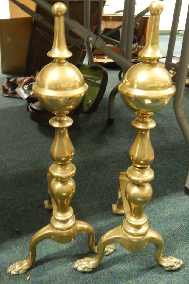 Appraisal: A pair of thC brass fire dogs each of turned