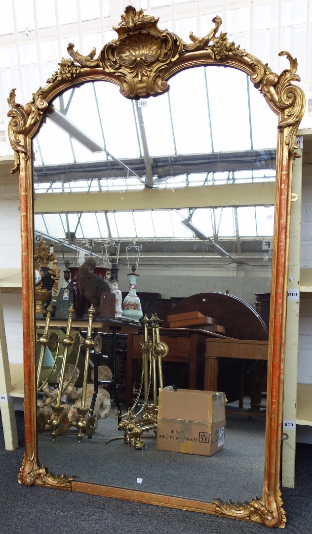 Appraisal: A th century gilt framed overmantel mirror with shell surmount