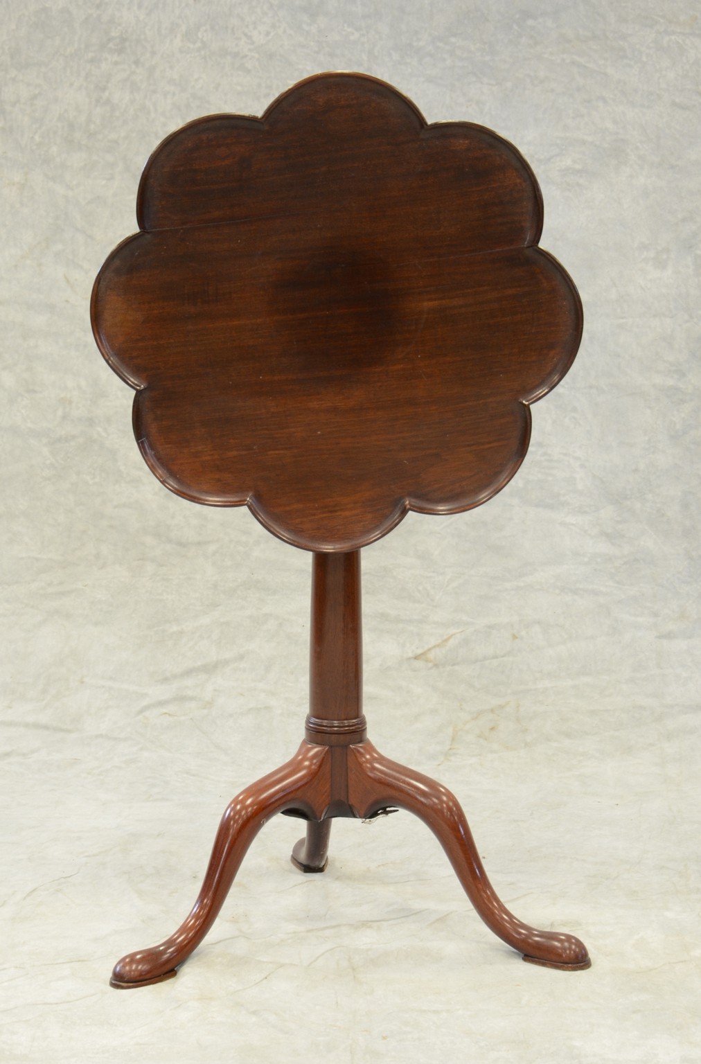 Appraisal: Mahogany clover shaped tilt top candlestand with tapered shaft and