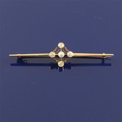 Appraisal: A diamond bar brooch Set with five small circular cut