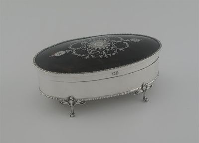 Appraisal: A modern oval dressing table box on four foliate legs