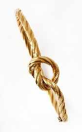 Appraisal: An Italian ct gold oval hinged woven rope love knot