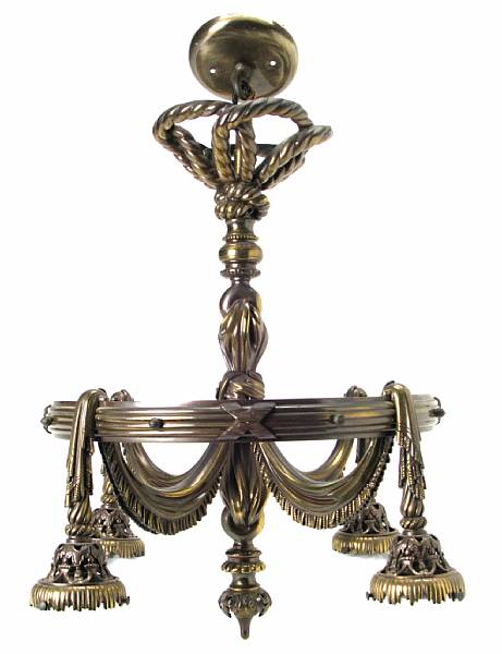 Appraisal: A Belle Epoque bronze four light chandelier with etched and